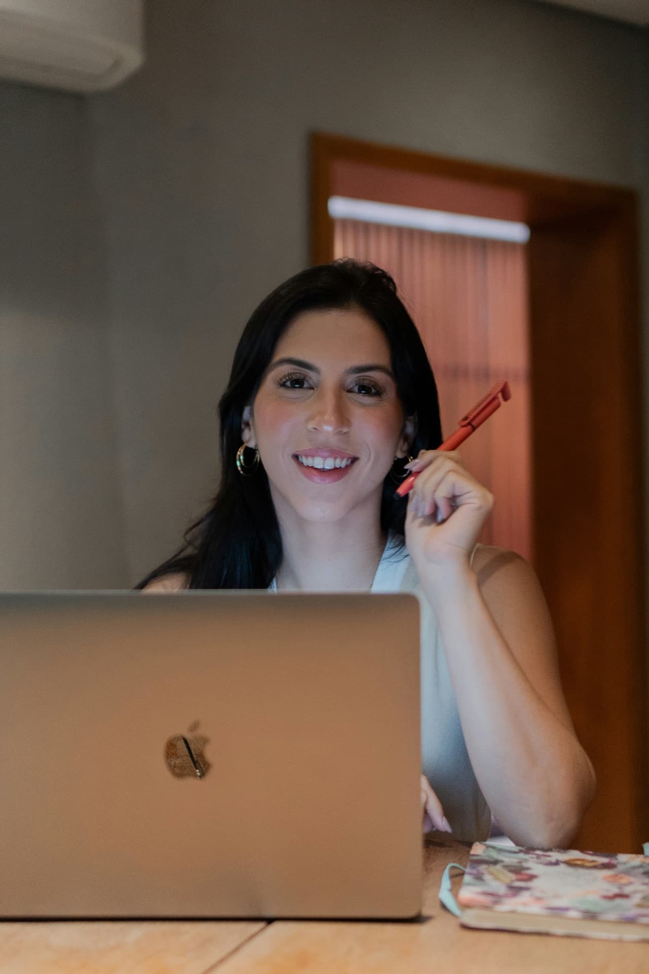 Spanish tutor smiling during a live video lesson